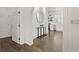 Bright hallway with dark hardwood floors and arched doorways at 4571 Columns Se Dr, Marietta, GA 30067