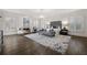 Spacious main bedroom with hardwood floors, fireplace, and large windows at 4571 Columns Se Dr, Marietta, GA 30067