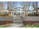 Elegant white mansion with stone steps and manicured landscaping at 4571 Columns Se Dr, Marietta, GA 30067