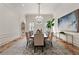 Formal dining room with chandelier and large art piece at 4571 Columns Se Dr, Marietta, GA 30067