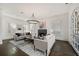Comfortable living room featuring a fireplace and large windows at 4571 Columns Se Dr, Marietta, GA 30067