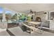 Covered patio with stone fireplace and outdoor dining area at 4571 Columns Se Dr, Marietta, GA 30067