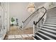 Elegant curved staircase in bright entryway at 4571 Columns Se Dr, Marietta, GA 30067