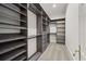 Large closet with custom shelving and hanging rods at 4571 Columns Se Dr, Marietta, GA 30067