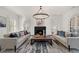 Spacious living room with a fireplace, hardwood floors, and ample natural light at 4571 Columns Se Dr, Marietta, GA 30067