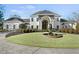 Luxury home with circular driveway and fountain at 4571 Columns Se Dr, Marietta, GA 30067