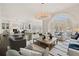 Open living space with hardwood floors, comfortable seating and large windows at 4571 Columns Se Dr, Marietta, GA 30067