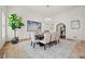 Spacious dining room with a large table and chandelier at 4571 Columns Se Dr, Marietta, GA 30067