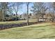 Landscaped green space with a creek, playground, and gazebo visible at 4571 Columns Se Dr, Marietta, GA 30067