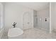 Spa-like bathroom with a walk-in shower and freestanding tub at 4571 Columns Se Dr, Marietta, GA 30067