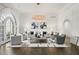 Spacious living room featuring hardwood floors, and a large chandelier at 4571 Columns Se Dr, Marietta, GA 30067