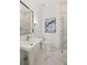Modern bathroom with marble floors, a glass shower, and a white vanity at 4571 Columns Se Dr, Marietta, GA 30067