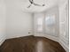 Spacious bedroom with dark hardwood floors and plantation shutters at 4571 Columns Se Dr, Marietta, GA 30067