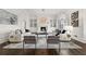 Living room with hardwood floors, comfortable seating and a large chandelier at 4571 Columns Se Dr, Marietta, GA 30067
