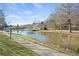 Peaceful walkway alongside a picturesque pond at 4571 Columns Se Dr, Marietta, GA 30067