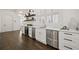 Modern kitchen with white cabinets, stainless steel appliances, and marble countertops at 4571 Columns Se Dr, Marietta, GA 30067