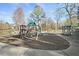 playground with swings and climbing structures near a pond at 4571 Columns Se Dr, Marietta, GA 30067