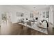 Living room with fireplace, built-in shelving and hardwood floors at 4571 Columns Se Dr, Marietta, GA 30067