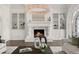Elegant marble fireplace with built-in shelving on either side at 4571 Columns Se Dr, Marietta, GA 30067