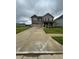 Two-story brick home with a two-car garage at 163 Kingfisher Walk, Covington, GA 30014