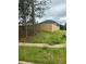 Landscaped backyard with wooden privacy fence at 163 Kingfisher Walk, Covington, GA 30014