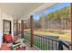 Back porch with wooden railings, seating, and backyard view at 401 County Line Rd, Fayetteville, GA 30215