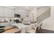 Modern kitchen with island, stainless steel appliances, and white cabinets at 600 Silver Moon Dr # 08, Loganville, GA 30052
