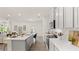 Modern kitchen with island, stainless steel appliances, and white cabinets at 600 Silver Moon Dr # 08, Loganville, GA 30052