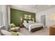 Spacious main bedroom with green accent wall and sitting area at 600 Silver Moon Dr # 08, Loganville, GA 30052