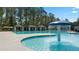 Community pool with mushroom fountain, cabanas, and ample deck space at 600 Silver Moon Dr # 08, Loganville, GA 30052