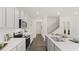 Open concept kitchen features stainless steel appliances and hardwood floors at 600 Silver Moon Dr # 08, Loganville, GA 30052