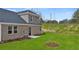 Private backyard with grassy area and small patio at 600 Silver Moon Dr # 08, Loganville, GA 30052