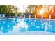 Relaxing community pool with shaded seating areas at 600 Silver Moon Dr # 08, Loganville, GA 30052
