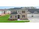 Two-story brick home with attached garage and manicured lawn at 600 Silver Moon Dr # 08, Loganville, GA 30052