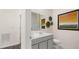 Modern bathroom with gray vanity, white toilet and shower/tub combo at 600 Silver Moon Dr # 08, Loganville, GA 30052