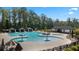 Resort-style pool with plenty of lounge chairs at 600 Silver Moon Dr # 08, Loganville, GA 30052