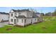 Two story home with partial stone elevation and landscaping at 600 Silver Moon Dr # 08, Loganville, GA 30052