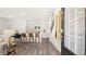 Open concept kitchen with island, hardwood floors, and view to living room at 600 Silver Moon Dr # 08, Loganville, GA 30052