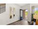Bright entryway with dark hardwood floors, mirrors, and view to backyard at 600 Silver Moon Dr # 08, Loganville, GA 30052