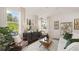 Spacious living room with large windows and comfortable seating area at 600 Silver Moon Dr # 08, Loganville, GA 30052