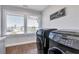 Bright laundry room with modern washer and dryer at 2334 Paces Ferry Se Rd, Smyrna, GA 30080