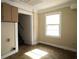Simple kitchen with tile floor, cabinets, and a window at 3371 Villa Rica Hwy, Dallas, GA 30157
