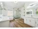 Luxurious bathroom with marble shower, soaking tub, and double vanity at 5286 Brookhollow Dr, Douglasville, GA 30135