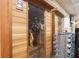 Luxurious cedar wood sauna with glass door and modern lighting at 5326 Presley Pl, Douglasville, GA 30135