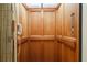 Clean and well-maintained wooden elevator interior at 5326 Presley Pl, Douglasville, GA 30135