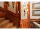 Elegant wooden staircase with detailed paneling and patterned carpeting at 5326 Presley Pl, Douglasville, GA 30135