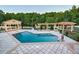 Expansive pool area with multiple gazebos and lush landscaping at 5326 Presley Pl, Douglasville, GA 30135