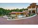 Gazebo and pool area with brick driveway and mansion in background at 5326 Presley Pl, Douglasville, GA 30135