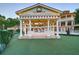 Elegant gazebo with a view of the mansion and pool at 5326 Presley Pl, Douglasville, GA 30135