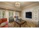 Elegant basement Gathering room with a large TV and comfortable seating at 5326 Presley Pl, Douglasville, GA 30135